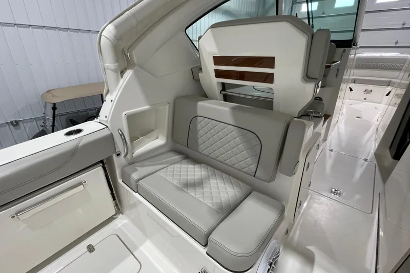 Slide: The Image of 2024 Pursuit DC 326 Dual Console interior with luxurious seating and modern design. - 24