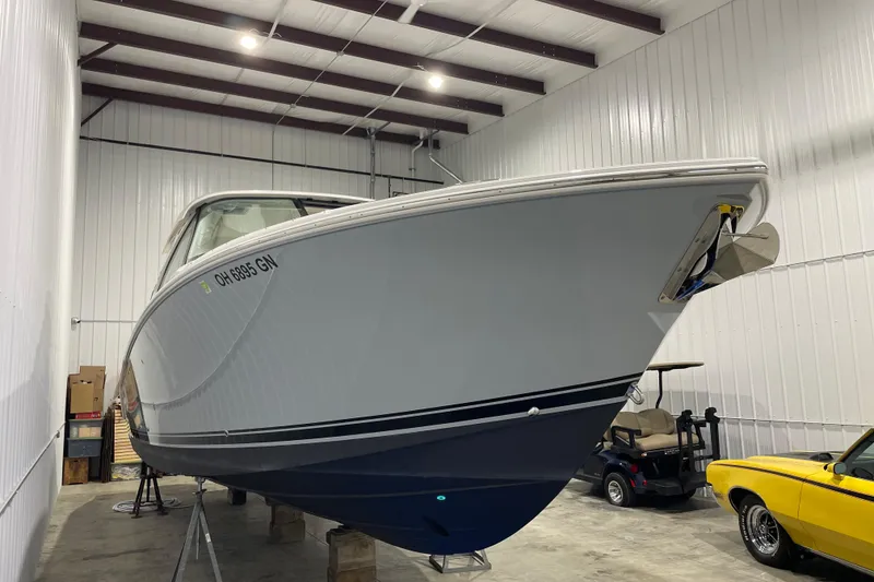 Slide: The Image of 2024 Pursuit DC 326 Dual Console boat interior with luxurious seating and modern design. - 3