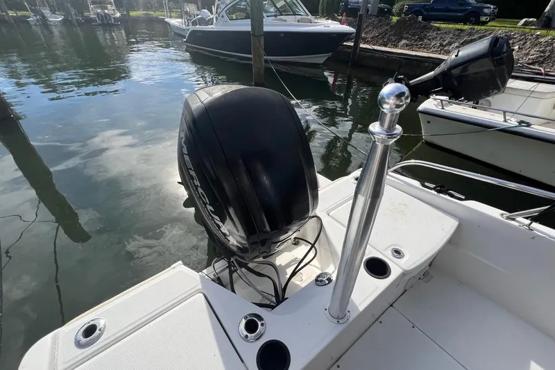 Slide: The Image of 2016 Boston Whaler 170 Dauntless boat with Mercury outboard motor docked in marina. - 16