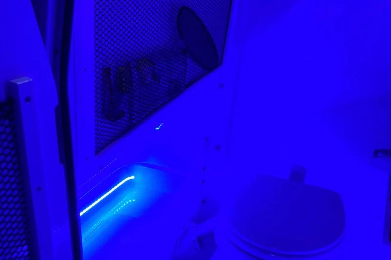 Slide: The Image of 2021 Sea Hunt Ultra 265 SE interior with blue LED lighting. - 34