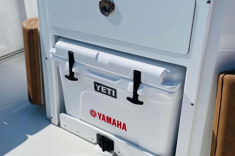 Slide: The Image of YETI cooler on 2021 Sea Hunt Ultra 265 SE boat with Yamaha branding. - 9
