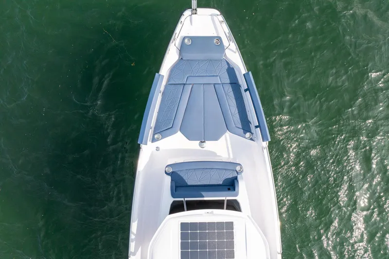 Slide: The Image of Top view of 2026 Axopar 29 XC Cross Cabin boat on water. - 12