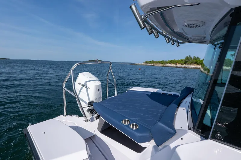 Slide: The Image of 2026 Axopar 29 XC Cross Cabin boat on open water, featuring sleek design and powerful engine. - 14
