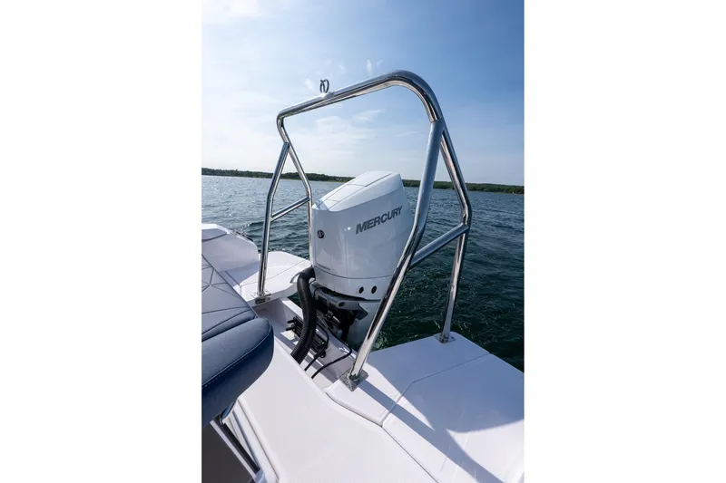 Slide: The Image of 2026 Axopar 29 XC Cross Cabin with Mercury outboard engine on open water. - 15