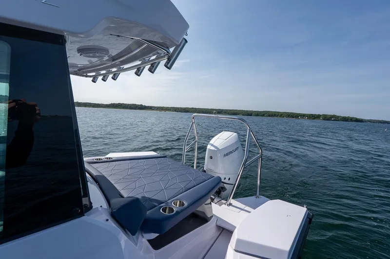 Slide: The Image of 2026 Axopar 29 XC Cross Cabin boat on open water, featuring Mercury outboard engine. - 17