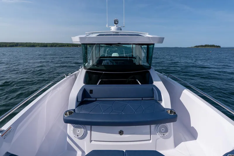 Slide: The Image of 2026 Axopar 29 XC Cross Cabin on open water, showcasing sleek design and spacious deck. - 20