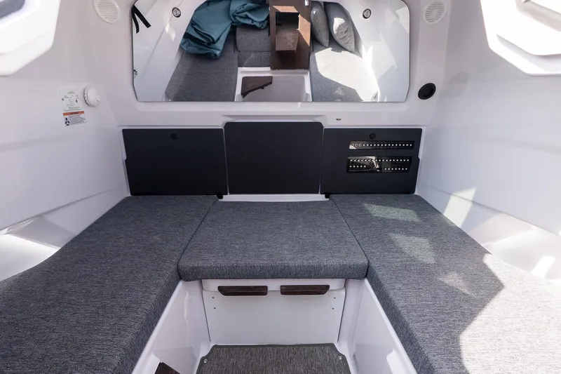 Slide: The Image of Interior of 2026 Axopar 29 XC Cross Cabin with gray seating and modern design. - 23