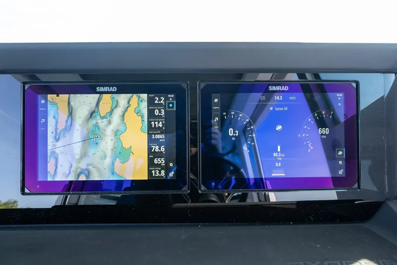 Slide: The Image of Simrad navigation displays on 2026 Axopar 29 XC Cross Cabin boat dashboard. - 31