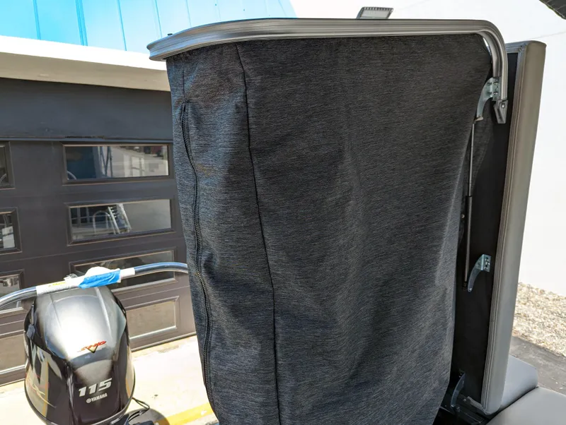 Slide: The Image of 2022 Trifecta 20C LE pontoon boat interior with plush seating and round table. - 12