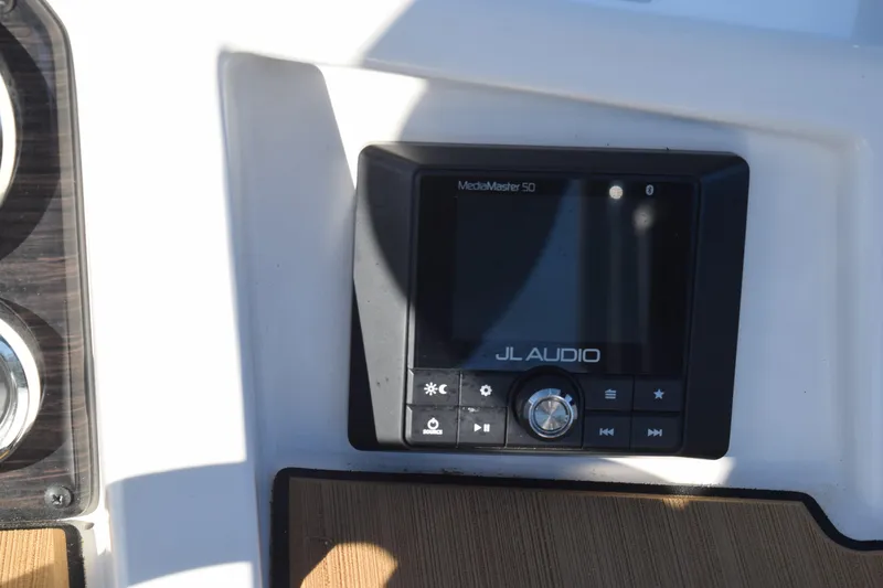 Slide: The Image of JL Audio MediaMaster 50 on 2023 Starcraft SVX 210 IO boat dashboard. - 18