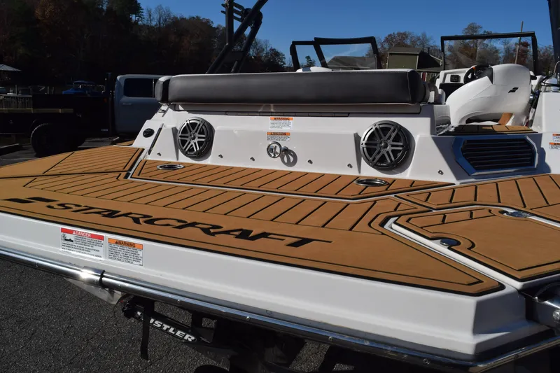 Slide: The Image of 2023 Starcraft SVX 210 IO boat with stylish deck and modern features. - 7