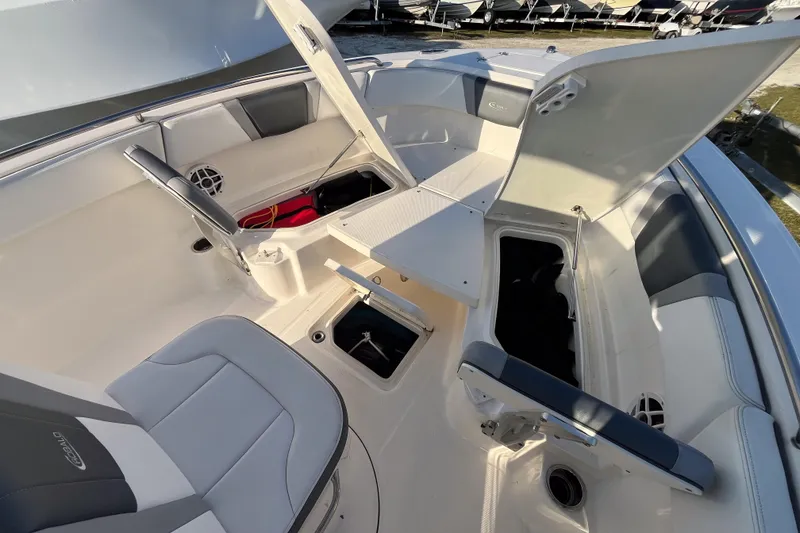 Slide: The Image of 2021 Robalo R230 Center Console boat interior with open storage compartments. - 12