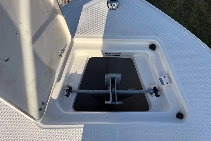 Slide: The Image of Open anchor compartment on 2021 Robalo R230 Center Console boat. - 13