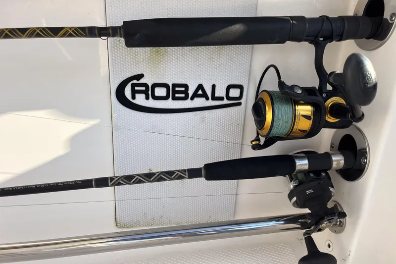 Slide: The Image of Fishing rods on a 2021 Robalo R230 Center Console boat deck. - 6