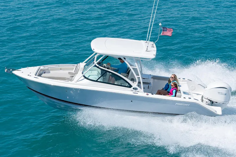 The Image of Manufacturer Provided Image: 2025 Pursuit DC 246 Dual Console boat cruising on clear blue water. - 0