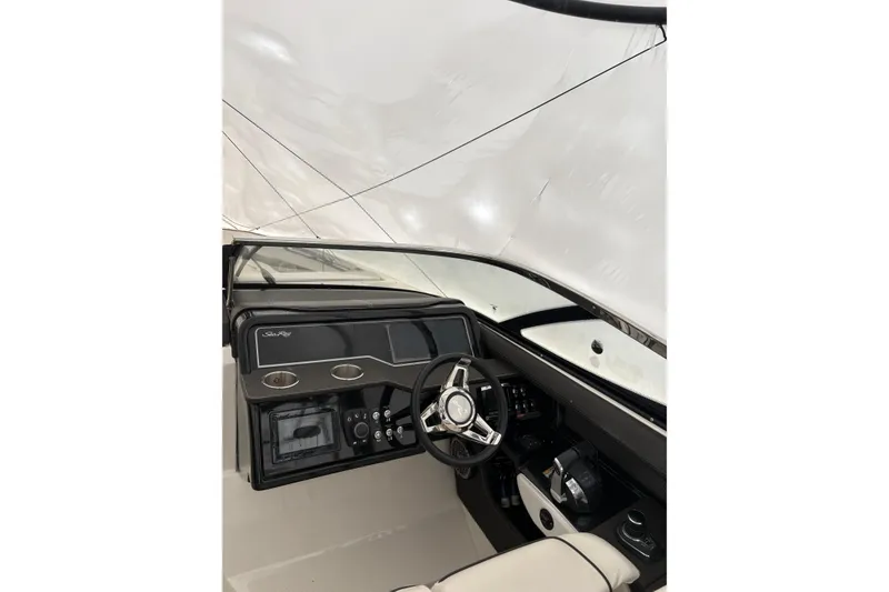 Slide: The Image of 2018 Sea Ray SLX 310 boat cockpit with modern steering and control panel. - 7