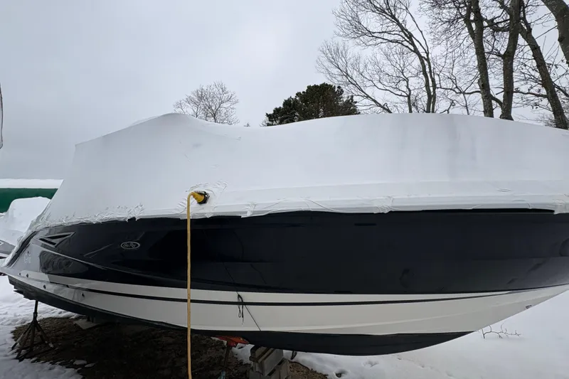 Slide: The Image of 2018 Sea Ray SLX 310 boat covered in snow, winter storage. - 3