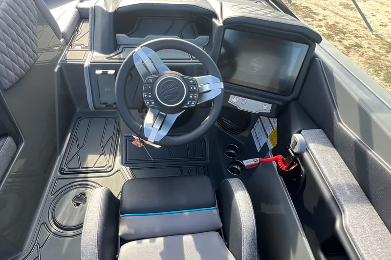 Slide: The Image of 2026 Tigé Z3 boat cockpit with modern steering wheel and touchscreen display. - 15