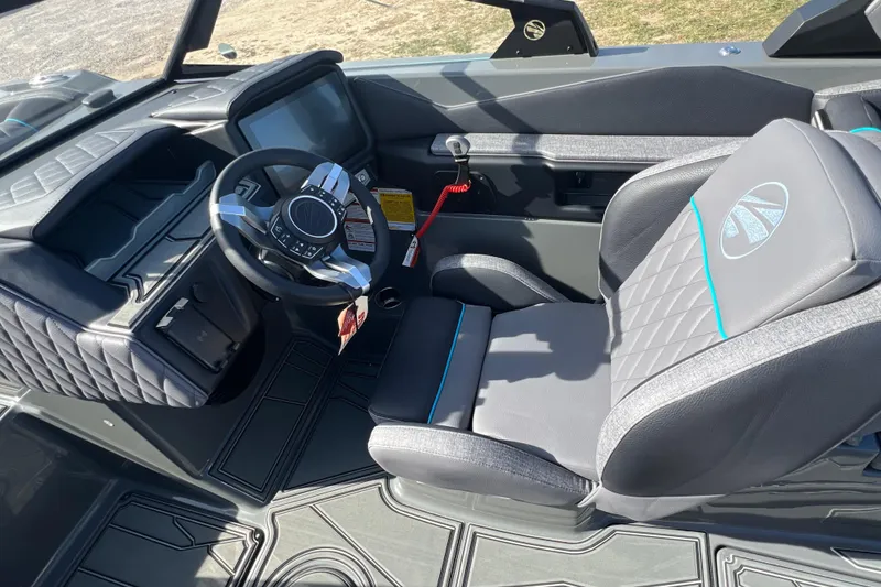 Slide: The Image of 2026 Tigé Z3 boat interior with modern steering wheel and comfortable seating. - 16