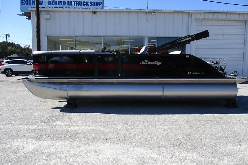 The Image of 2026 Bentley Pontoons Legacy 223 Swingback pontoon boat parked outdoors. - 1