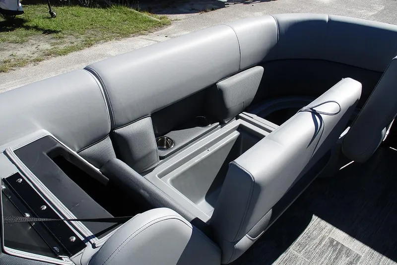 Slide: The Image of 2026 Bentley Pontoons Legacy 223 Swingback interior with gray seating and storage compartments. - 10