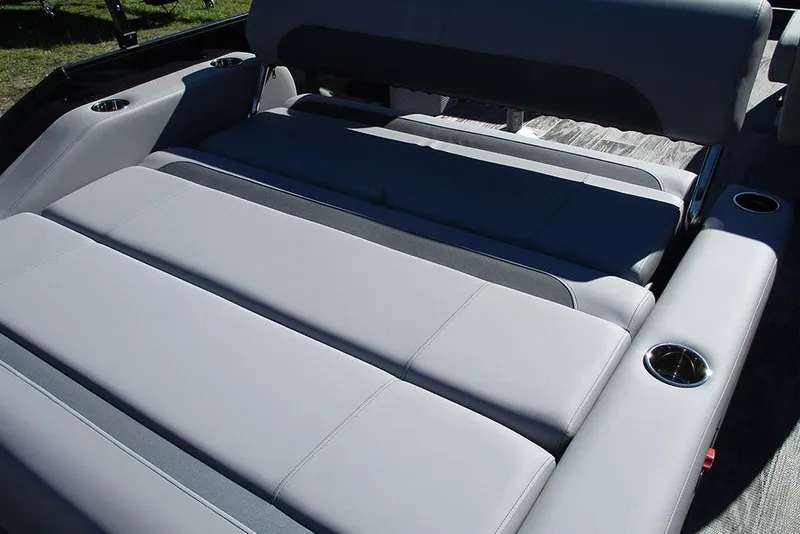 Slide: The Image of 2026 Bentley Pontoons Legacy 223 Swingback interior seating with cup holders, showcasing luxury design. - 20