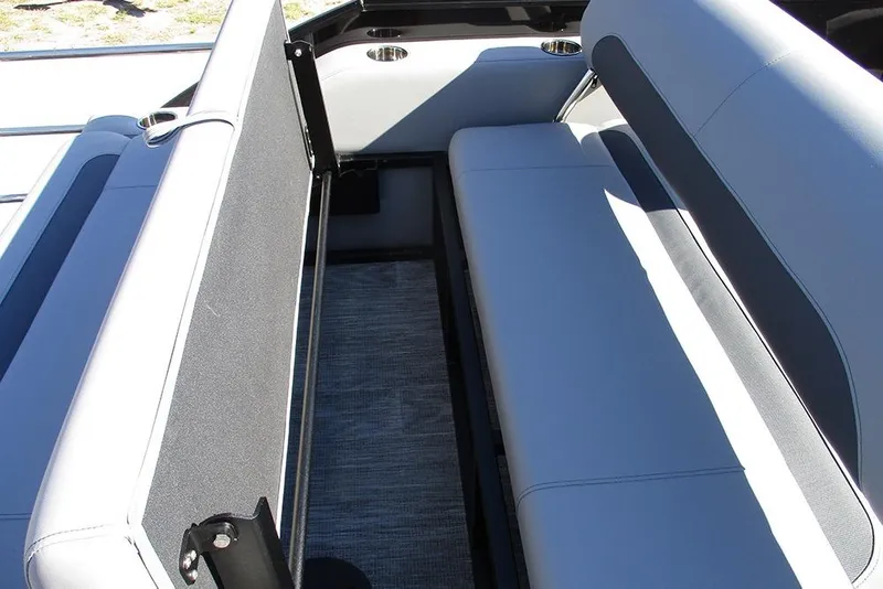 Slide: The Image of 2026 Bentley Pontoons Legacy 223 Swingback interior seating with cup holders and storage. - 22