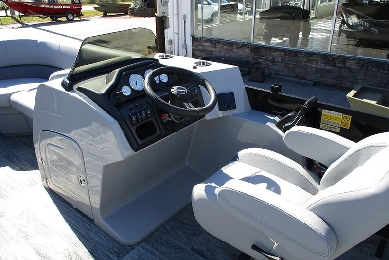 Slide: The Image of 2026 Bentley Pontoons Legacy 223 Swingback helm with modern controls and comfortable seating. - 24