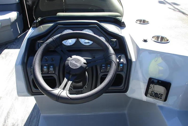 Slide: The Image of 2026 Bentley Pontoons Legacy 223 Swingback steering console with modern controls and gauges. - 27