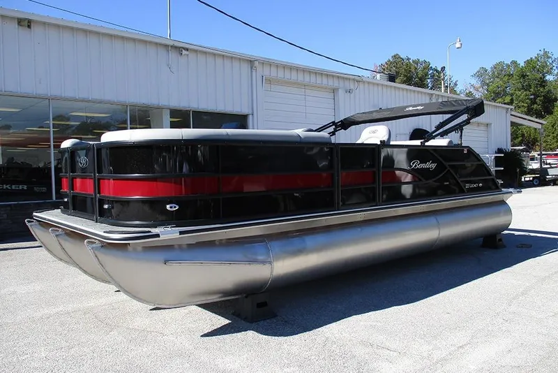 Slide: The Image of 2026 Bentley Pontoons Legacy 223 Swingback pontoon boat displayed outdoors. - 3