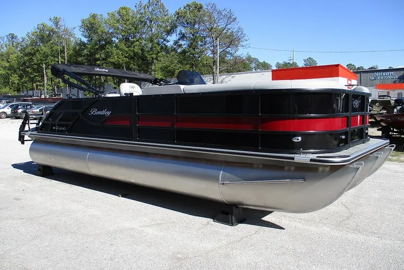 Slide: The Image of 2026 Bentley Pontoons Legacy 223 Swingback, black and red, parked outdoors. - 5