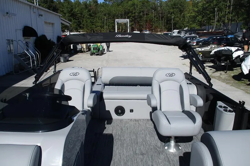 Slide: The Image of 2026 Bentley Pontoons Legacy 223 Swingback interior with plush seating and canopy. - 8
