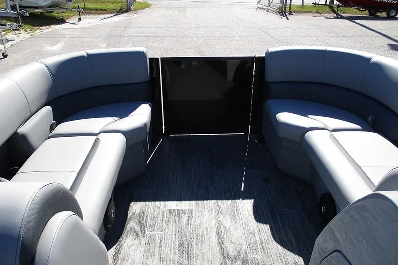 Slide: The Image of 2026 Bentley Pontoons Legacy 223 Swingback interior with gray seating and open deck. - 9