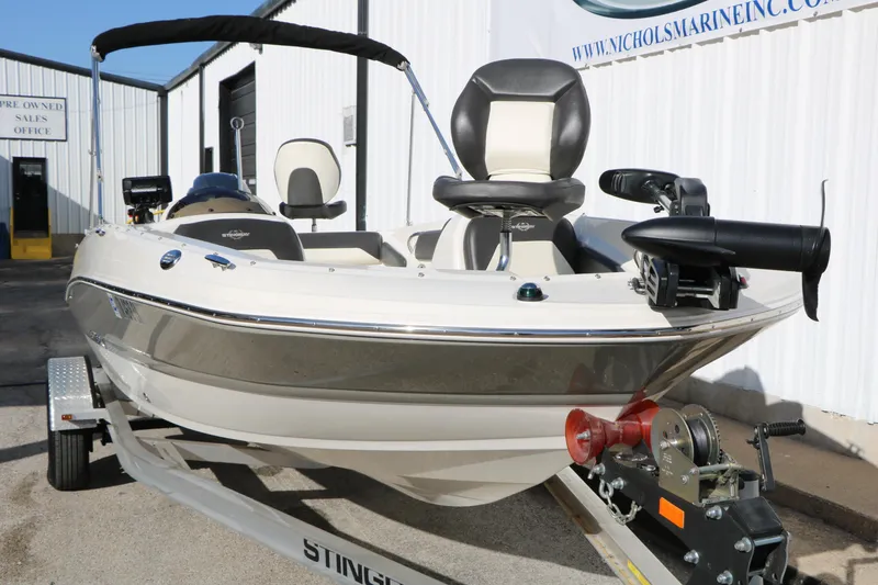 Slide: The Image of 2018 Stingray 182 SC boat on trailer, parked outside a sales office. - 10