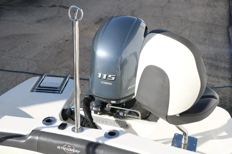 Slide: The Image of 2018 Stingray 182 SC boat with Yamaha 115 outboard motor and seating. - 27