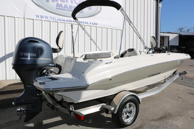 Slide: The Image of 2018 Stingray 182 SC boat with Yamaha outboard motor on trailer. - 3