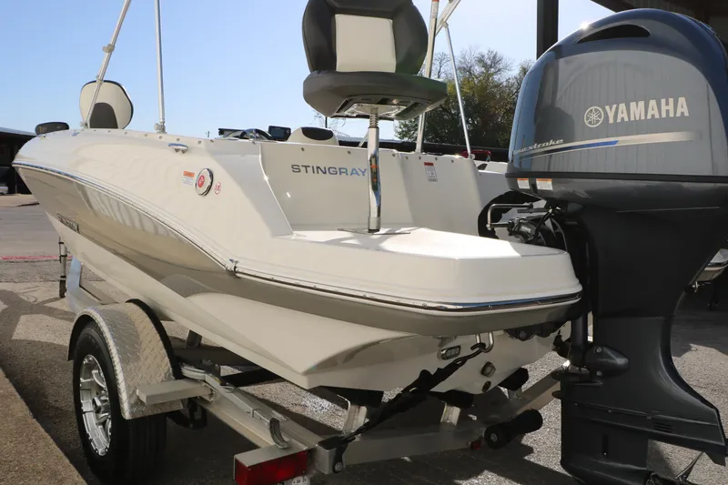 Slide: The Image of 2018 Stingray 182 SC boat with Yamaha outboard motor on trailer. - 8