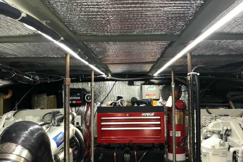 Slide: The Image of Engine room of 2000 Carver 530 Voyager Pilothouse with tools and equipment. - 15