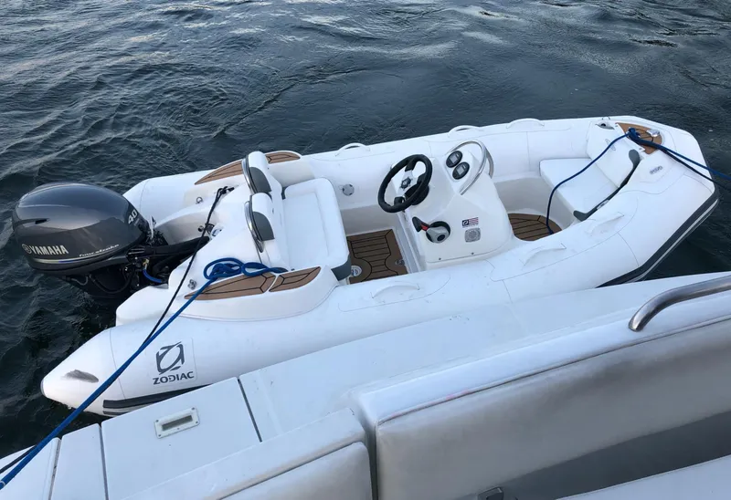 Slide: The Image of Inflatable Zodiac boat with Yamaha motor docked beside Carver 530 Voyager Pilothouse, 2000 model. - 23