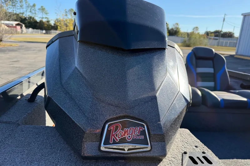 Slide: The Image of 2022 Ranger RT178 boat with logo, parked outdoors on a sunny day. - 10