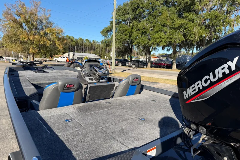 Slide: The Image of 2022 Ranger RT178 boat with Mercury engine, parked outdoors on a sunny day. - 14