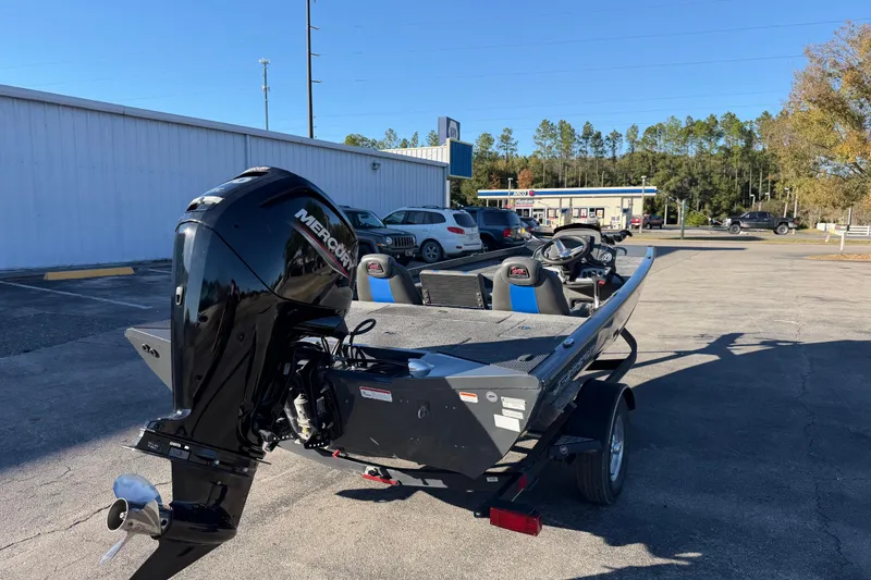 Slide: The Image of 2022 Ranger RT178 boat with Mercury engine parked outdoors. - 7