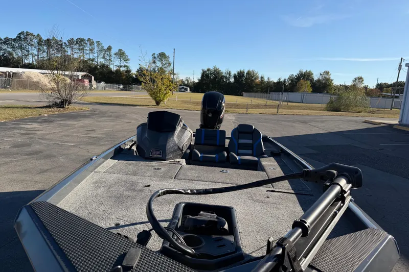Slide: The Image of 2022 Ranger RT178 fishing boat with motor, parked outdoors on a sunny day. - 8