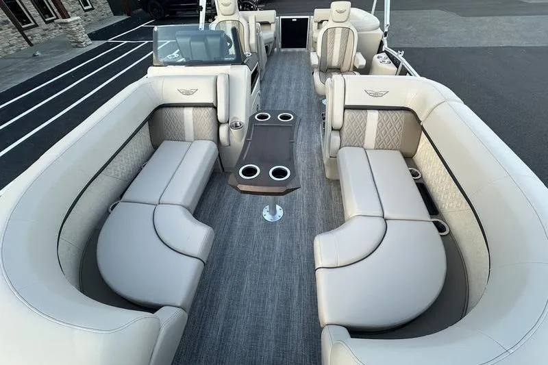 Slide: The Image of Luxurious interior of 2026 Bennington M Quad Bench 22 MFB pontoon boat with plush seating. - 11