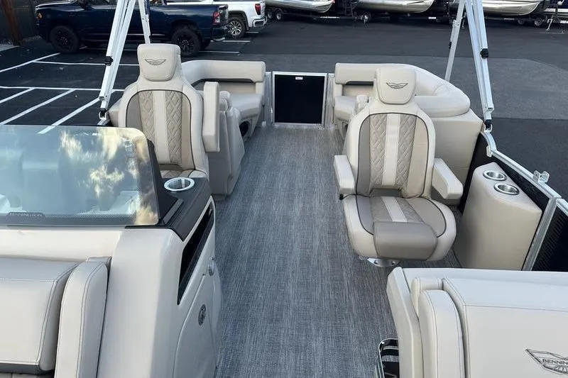 Slide: The Image of 2026 Bennington M Quad Bench 22 MFB pontoon boat interior with luxurious seating and modern design. - 18