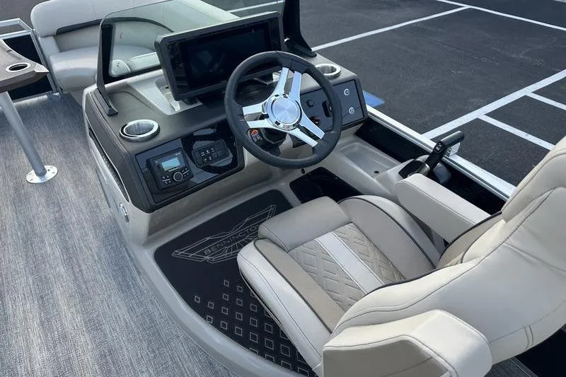 Slide: The Image of Captain's seat and helm of 2026 Bennington M Quad Bench 22 MFB boat. - 21