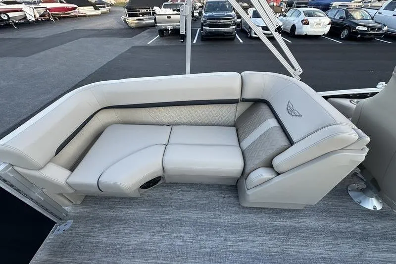 Slide: The Image of Luxurious seating on 2026 Bennington M Quad Bench 22 MFB pontoon boat, parked in marina. - 28