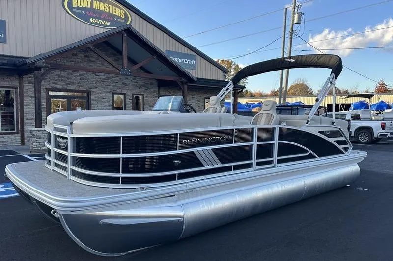 Slide: The Image of 2026 Bennington M Quad Bench 22 MFB pontoon boat at dealership, sunny day. - 3