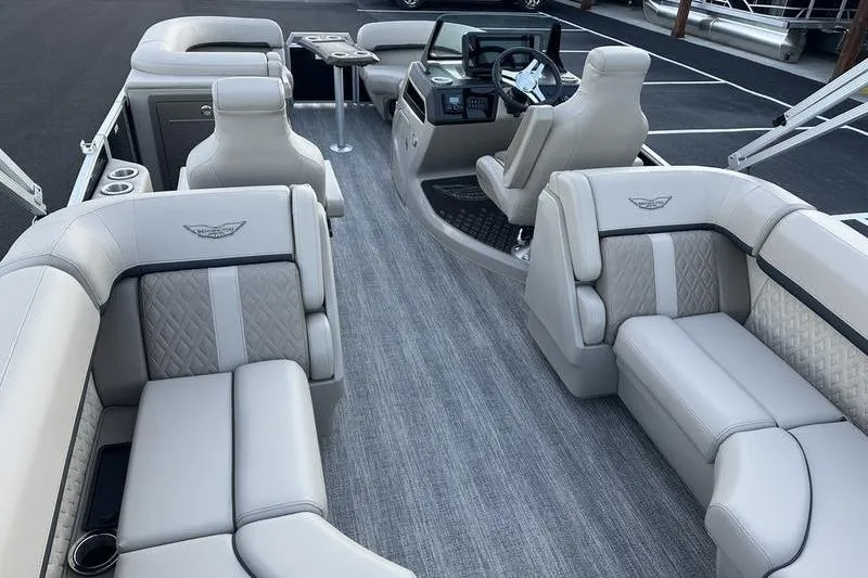 Slide: The Image of 2026 Bennington M Quad Bench 22 MFB interior with luxurious seating and modern dashboard. - 4