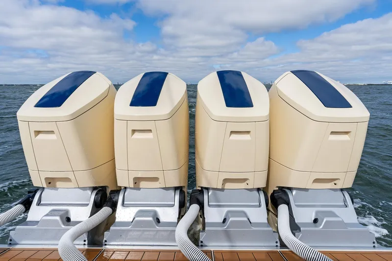 Slide: The Image of Four powerful outboard engines on a 2023 HCB 53 Suenos RXV boat. - 12